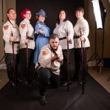 Durmstrang and Beauxbatons cosplayers pose in the photo booth.