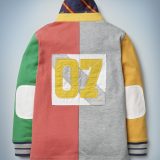 This view of the back of the Mini Boden Hogwarts Rugby Shirt, multi-color, shows a patch featuring Harry Potter’s Quidditch number: 07. It retails at £30.