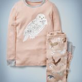 The Mini Boden Harry Potter Long John Pyjamas in pink feature all-over images of owls delivering Hogwarts acceptance letters on the pants and a large central image of Hedwig with Harry Potter’s acceptance letter in her beak on the long-sleeved top. The top-and-bottom set retails at £24.