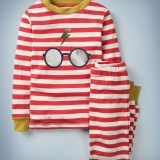 The Mini Boden Harry Potter Long John Pyjamas in red feature all-over red-and-white stripes with gold collar and cuffs, as well as a large central design of Harry Potter’s glasses and lightning bolt scar. The top-and-bottom set retails at £24.