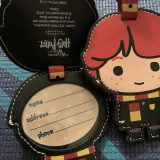 Your “Wizarding World of Harry Potter Exclusive Vacation Package” will include one set of three luggage tags (Harry, Ron, and Hermione). The backs of the tags lift to reveal the owner’s personal information.