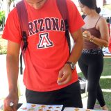 A University of Arizona student works to build a Golden Snitch from LEGO bricks during a Back to Hogwarts event at the school.