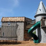The slide descending from the playhouse’s tower