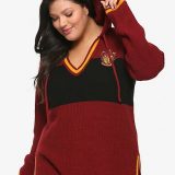 A model shows off the drawstring hood on her Gryffindor sweater from Hot Topic.