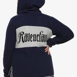 The back of Hot Topic’s hooded Ravenclaw sweater is pictured; each sweater features the chosen House’s name emblazoned across the back.