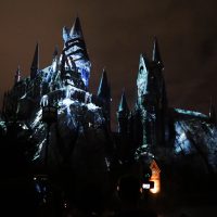 Dementors’ icy fingers grip the tower in the “Dark Arts at Hogwarts Castle” light show.