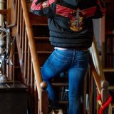 A model shows off the back of his Gryffindor padded jacket from Merchoid.