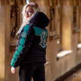 A model shows off the Slytherin padded jacket from Merchoid.