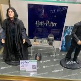 Figurines of Snape and Draco stand beside each other.