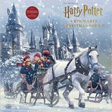 The front cover of this pop-up book has gorgeous artwork of Harry, Ron, and Hermione in front of Hogwarts castle.
