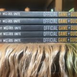 “Harry Potter: Wizards Unite: Official Game Guide”, stack of books