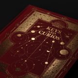 The Keys and Curios cover, designed by MinaLima