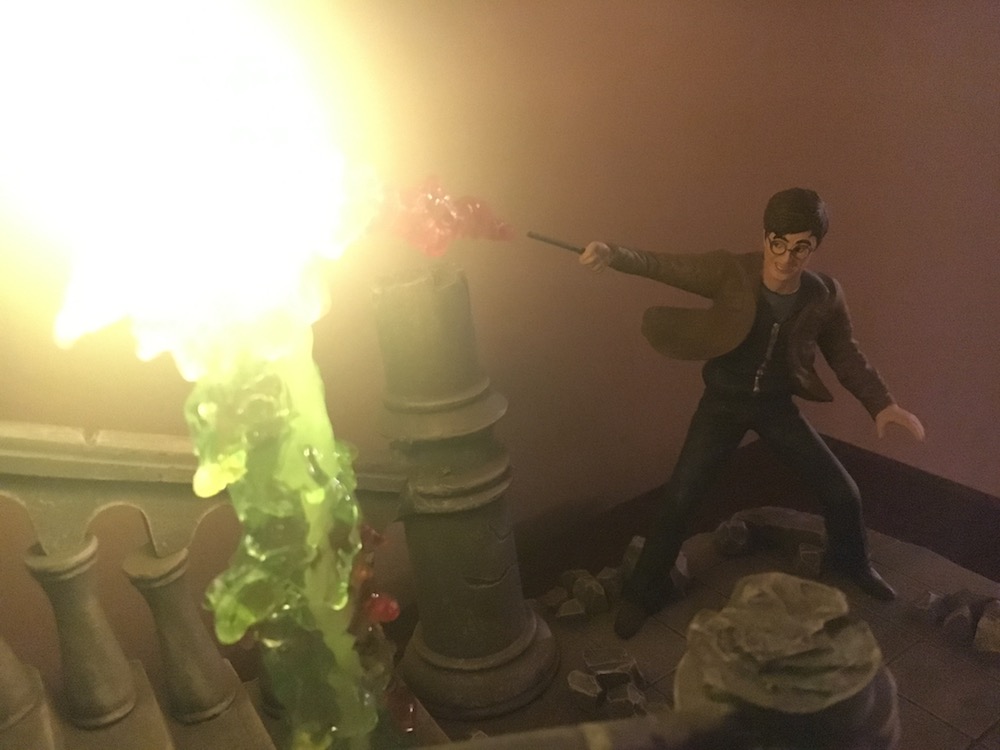 Harry’s Disarming Charm in a burst of red light