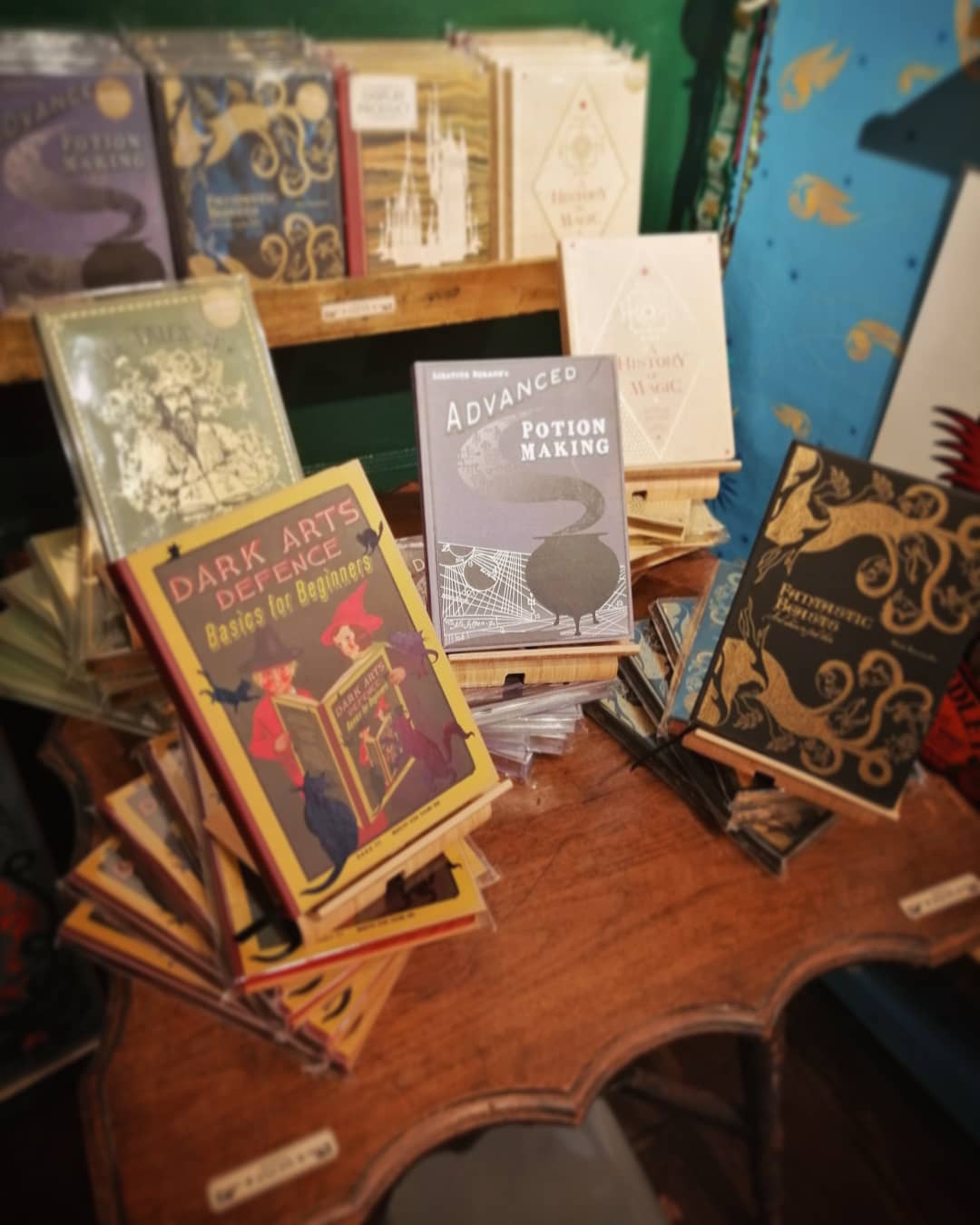 You can get a good look at all the Hogwarts textbooks in real life in MinaLima’s gallery.