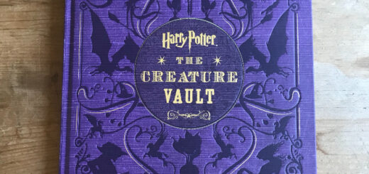 Purple book cover with the words "Harry Potter: The Creature Vault" in gold letters