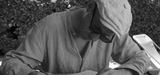 David Thewlis is pictured writing his novel "Shooting Martha" with a notebook and pen.