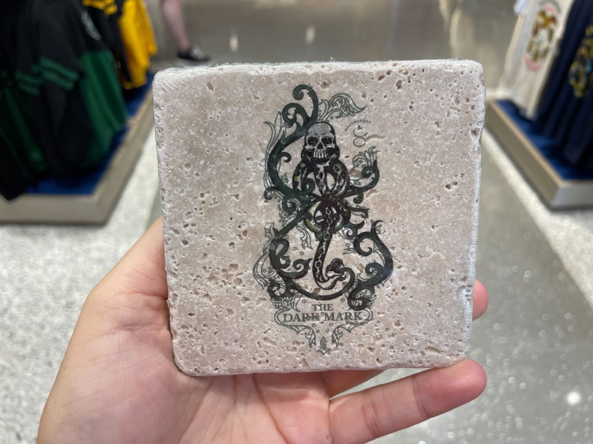 A stone coaster features the Dark Mark at Universal Orlando Resort.