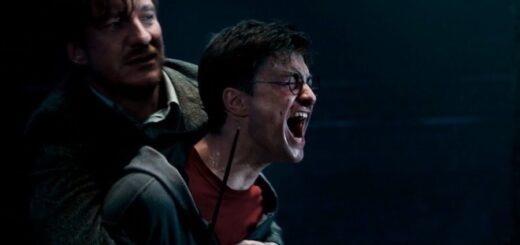 A still from Harry Potter and the Order of the Phoenix where Harry screams as Remus Lupin holds him.