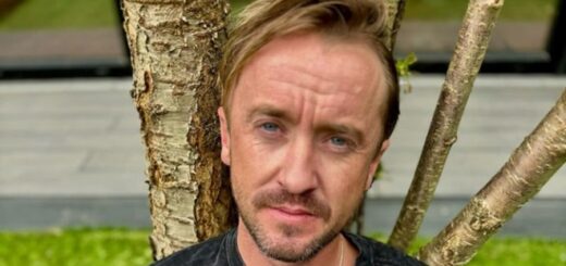 Tom Felton in front of tree