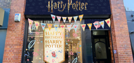 Harry Potter storefront with decorations that read "Happy Birthday Harry Potter!"
