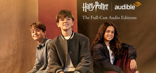 Three young actors in front of a fabric banner with the Harry Potter logo above them